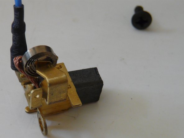 Disassembling Bauker PGA115G1.2 Angle grinder, Remove the brushes: crwdns2935265:012crwdnd2935265:02crwdnd2935265:03crwdne2935265:0