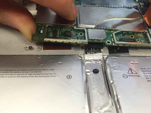In order to prevent a short circuit, insert a piece of cardboard, paper or plastic between the battery connector and motherboard before sliding the battery cable out from under the motherboard.