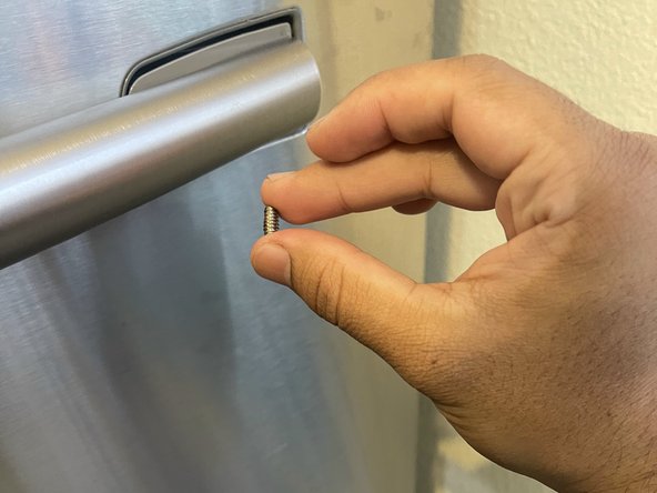 Samsung RF263BEAESR Freezer Door Handle Replacement: step 4, image 2 of 3