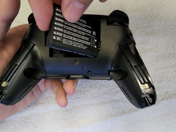 How to Eliminate Joystick Drift from a Nintendo Switch Pro Controller, Removing the battery: crwdns2935265:03crwdnd2935265:02crwdnd2935265:03crwdne2935265:0