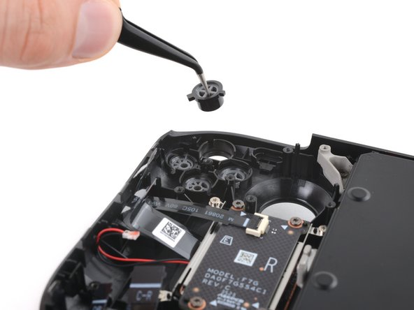 Steam Deck OLED Front Shell Replacement, Remove the action buttons: crwdns2935265:060crwdnd2935265:02crwdnd2935265:03crwdne2935265:0