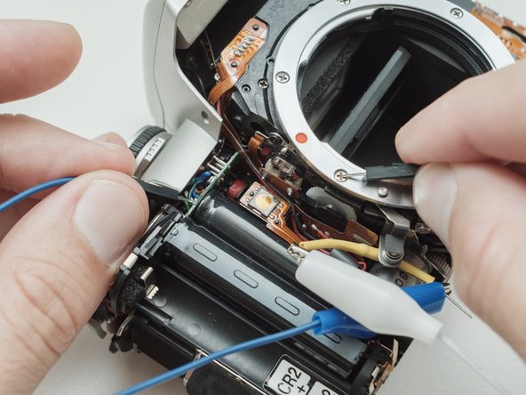 Pentax ZX-5n Flash Pivot Replacement, Discharge flash capacitors: step 9, image 1 of 1