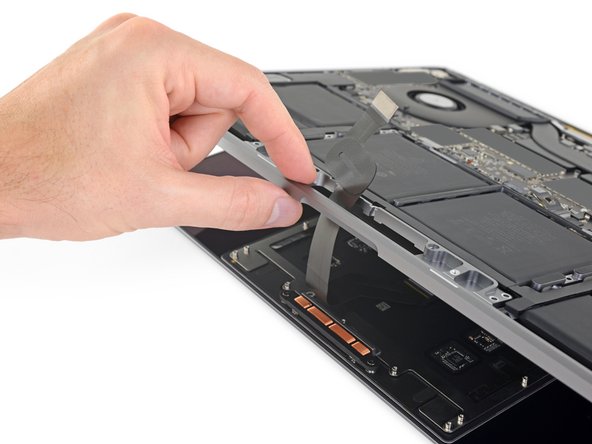 MacBook Pro 16" 2019 Battery Replacement, Remove the trackpad: crwdns2935265:022crwdnd2935265:02crwdnd2935265:03crwdne2935265:0