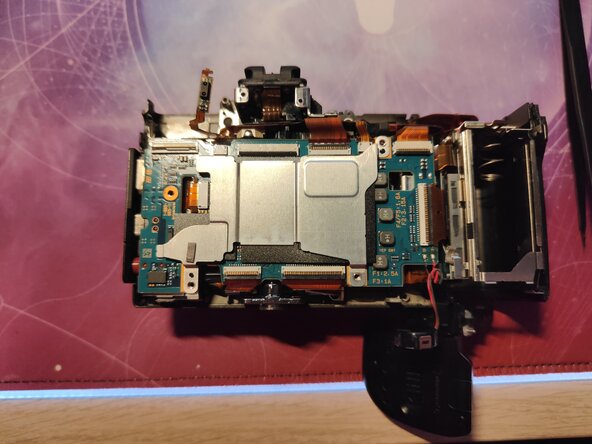 Sony NEX-7 Sony NEX-7 Shutter Assembly Replacement, Remove the metal shield and motherboard: step 31, image 2 of 3
