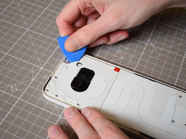 Nothing Phone (2a) Battery Replacement, Remove the sticker surrounding the camera unit: crwdns2935265:03crwdnd2935265:02crwdnd2935265:03crwdne2935265:0