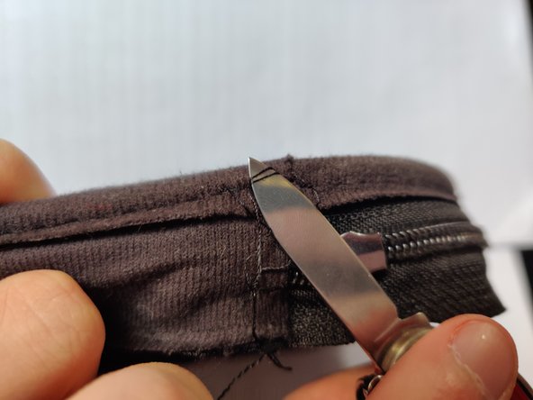 Bose QuietComfort 35 Case Zipper Replacement, Dealing with the stopper knot: crwdns2935265:016crwdnd2935265:02crwdnd2935265:03crwdne2935265:0