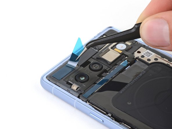 How to Apply Rear Cover Adhesive in Your Google Pixel 7a, Apply the top rear cover adhesive: crwdns2935265:05crwdnd2935265:02crwdnd2935265:02crwdne2935265:0