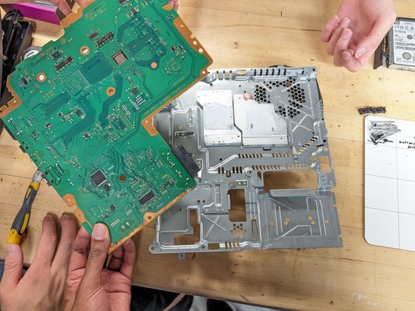 PlayStation 3 Slim Thermal Paste Replacement, Remove motherboard: crwdns2935265:024crwdnd2935265:03crwdnd2935265:03crwdne2935265:0