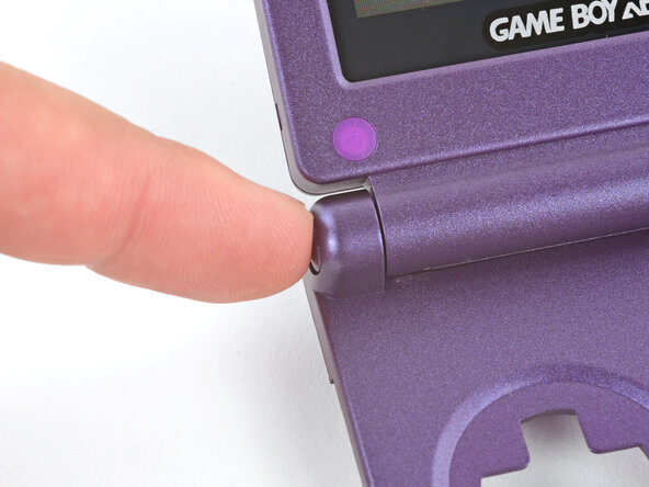 How to Reshell Your Game Boy Advance SP, Install the hinges: crwdns2935265:046crwdnd2935265:03crwdnd2935265:03crwdne2935265:0