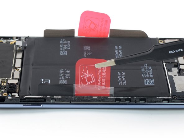 OnePlus Nord 2 5G Battery Replacement, Peel up the left pull tab: crwdns2935265:021crwdnd2935265:02crwdnd2935265:02crwdne2935265:0