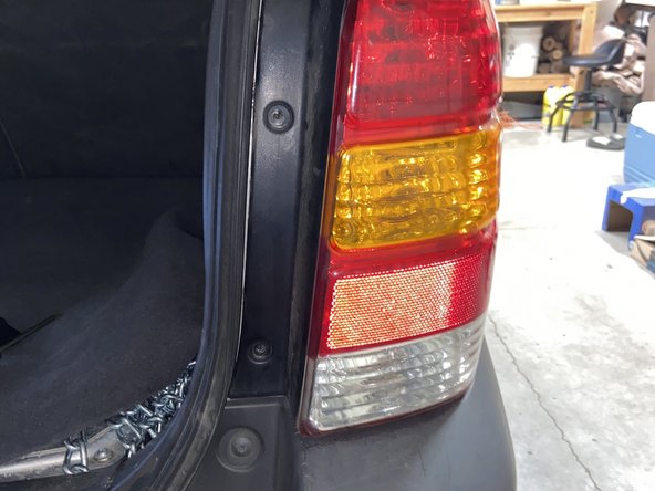 How to Replace a Brake Light for a 2006 Ford Escape Hybrid: step 9, image 2 of 2