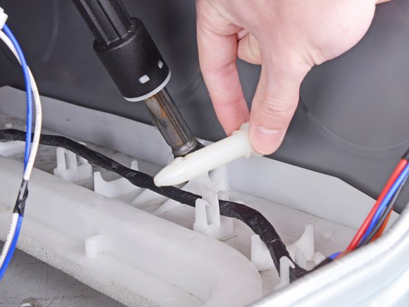 LG Front Load Washing Machine Dampers Replacement, Remove the plastic pin: crwdns2935265:031crwdnd2935265:02crwdnd2935265:02crwdne2935265:0