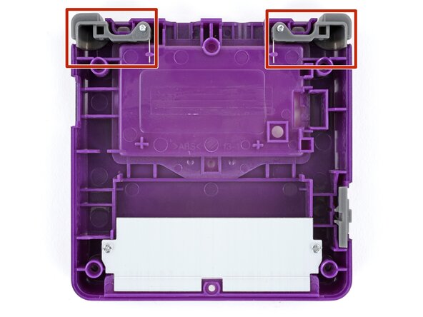 How to Reshell Your Game Boy Advance SP, Install the shoulder buttons: crwdns2935265:063crwdnd2935265:01crwdnd2935265:03crwdne2935265:0