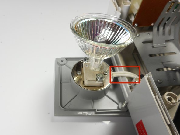 Merch Source Projector Entertainment II Light Bulb Replacement, Remove light bulb assembly from housing unit: crwdns2935265:04crwdnd2935265:03crwdnd2935265:03crwdne2935265:0