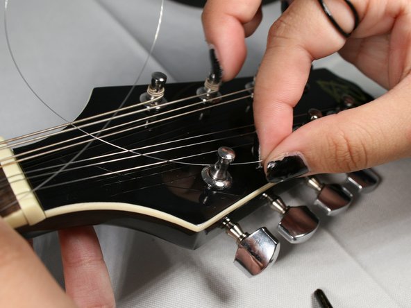How to Replace the Strings on your Rogue RM-100A A-Style Mandolin: step 5, image 1 of 2