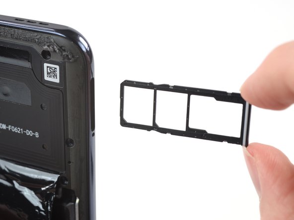 Xiaomi Redmi Note 10S Battery Replacement, Eject the SIM card tray: crwdns2935265:013crwdnd2935265:03crwdnd2935265:03crwdne2935265:0