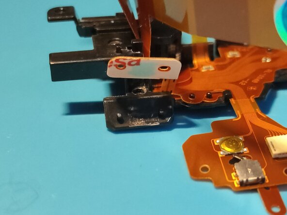 Sony A7 II Top Flex Cable replacement, Inserting it back into the plastic frame: crwdns2935265:036crwdnd2935265:02crwdnd2935265:03crwdne2935265:0