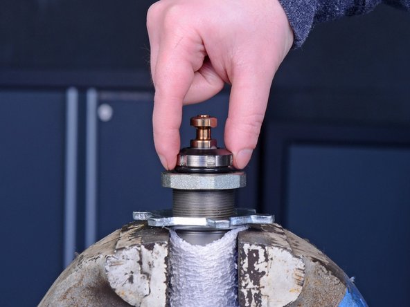 During reassembly, torque the top jam nut to 70-80 ft. lb.