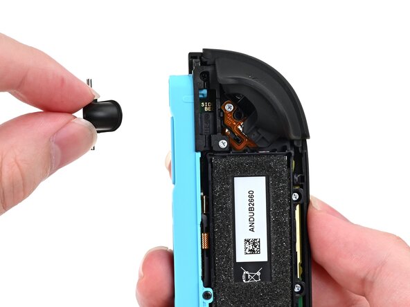 Joy-Con 2 (Left) Joystick Replacement, Remove the release button: crwdns2935265:012crwdnd2935265:02crwdnd2935265:02crwdne2935265:0