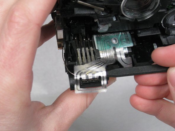 In the same manner as above, remove the band wire from the plastic extension.