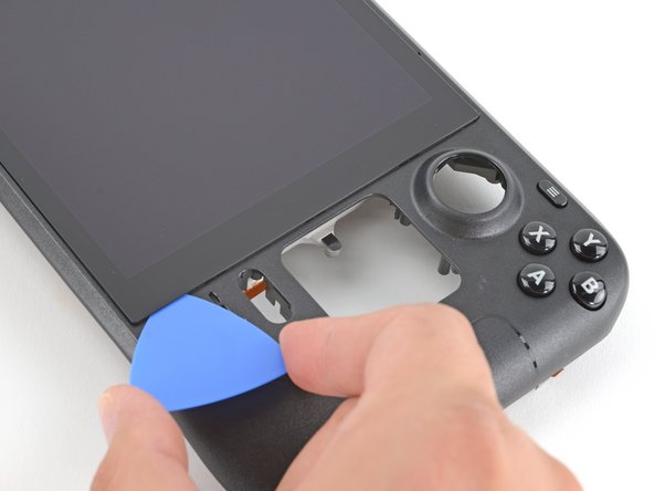 Steam Deck Front Shell Replacement, Slice the right side adhesive: crwdns2935265:079crwdnd2935265:03crwdnd2935265:03crwdne2935265:0