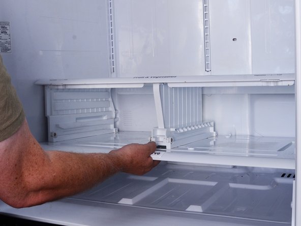 How to Test and Replace the Rear Air Duct and Damper on your LG Refrigerator Model LFX25973, Release the drawer frame: step 5, image 2 of 2