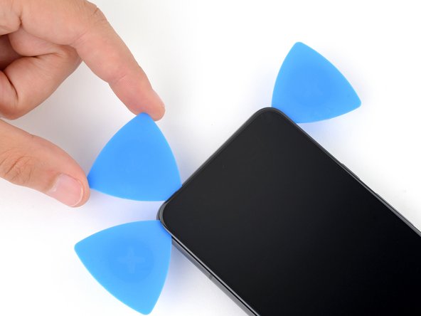 Google Pixel 8 Back Cover Replacement, Separate the top edge adhesive: step 17, image 1 of 2