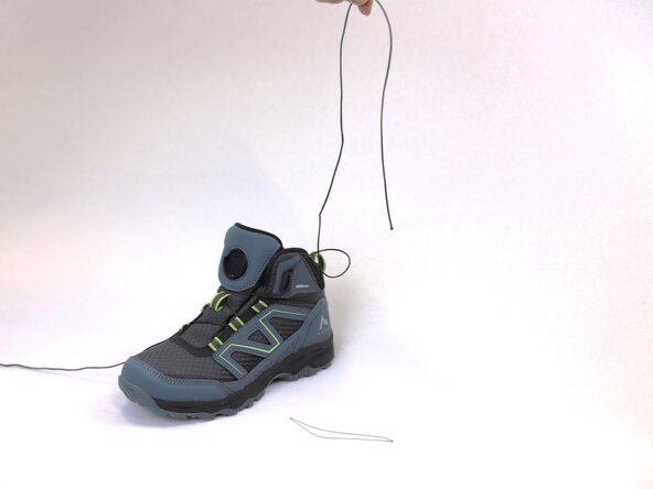 How to Replace a Dial-Lace System in a Hiking Boot, Remove the lace from the metal loop: crwdns2935265:08crwdnd2935265:03crwdnd2935265:03crwdne2935265:0