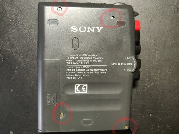 Sony TCM-353V Belts Replacement, Unscrew back-cover: crwdns2935265:01crwdnd2935265:02crwdnd2935265:02crwdne2935265:0