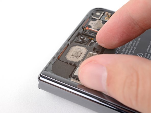 How to Apply New Top Speaker Adhesive in Your Google Pixel Fold, Secure the top speaker: crwdns2935265:03crwdnd2935265:02crwdnd2935265:03crwdne2935265:0