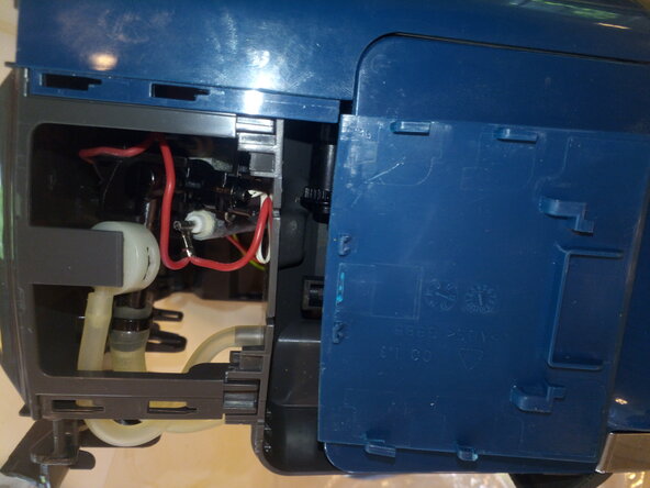 Bosch CTPM Tassimo fix pump error, Open the housing (top): step 1, image 3 of 3