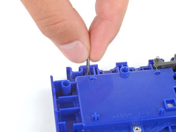 How to Install Shoulder Buttons in Your Game Boy Advance SP, Install the hinge pin: crwdns2935265:01crwdnd2935265:02crwdnd2935265:02crwdne2935265:0