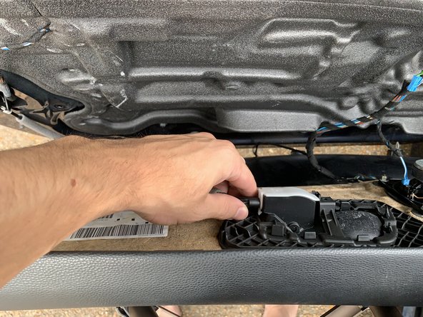 Unclip the internal door handle mechanism inside the door handle by rotating clockwise.