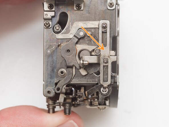 Pentax Super Program Mirror Box Mechanism Service, Remove auto-aperture control lever: crwdns2935265:031crwdnd2935265:02crwdnd2935265:02crwdne2935265:0