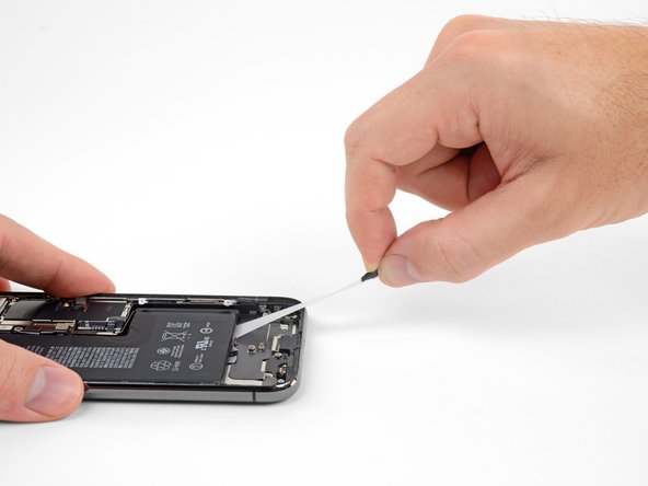 Repeat the previous step to remove the strip on the opposite side, leaving the center strip for last.