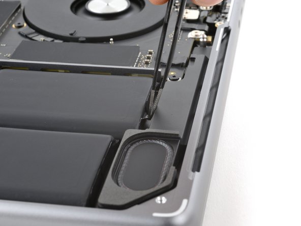 MacBook Pro 14" Late 2023 (M3) Battery Replacement, Peel the pull tabs: crwdns2935265:030crwdnd2935265:02crwdnd2935265:03crwdne2935265:0