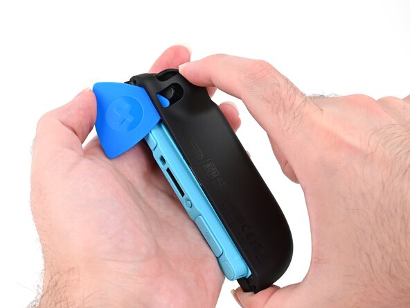 Joy-Con 2 (Left) Battery Replacement, Release the back cover: crwdns2935265:09crwdnd2935265:02crwdnd2935265:03crwdne2935265:0