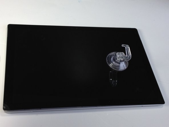 Attach a suction cup to the front of the display.