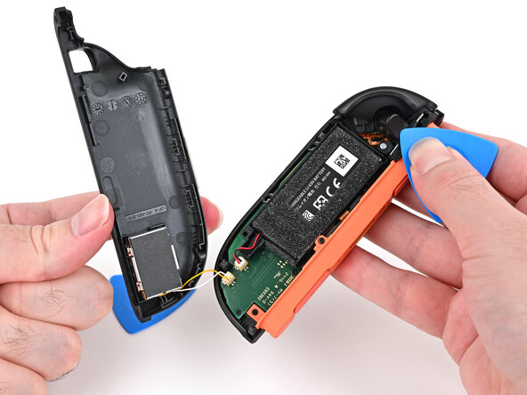 Joy-Con 2 (Right) Joystick Replacement, Release the back cover: crwdns2935265:09crwdnd2935265:03crwdnd2935265:03crwdne2935265:0