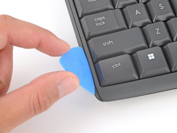 How to Open Your Logitech K295 Keyboard, Insert an opening pick: crwdns2935265:06crwdnd2935265:01crwdnd2935265:03crwdne2935265:0