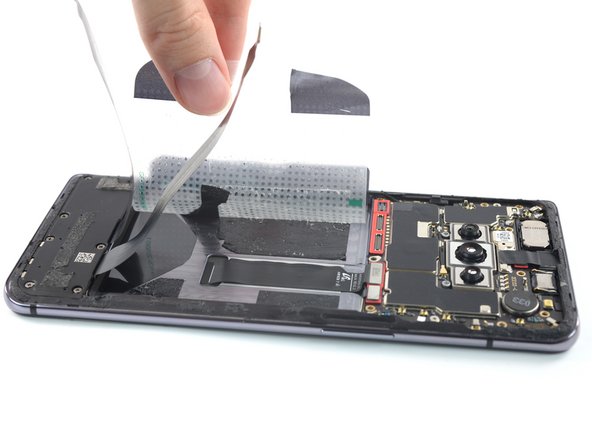 OnePlus 7T Screen Replacement, Remove the plastic film: crwdns2935265:017crwdnd2935265:03crwdnd2935265:03crwdne2935265:0