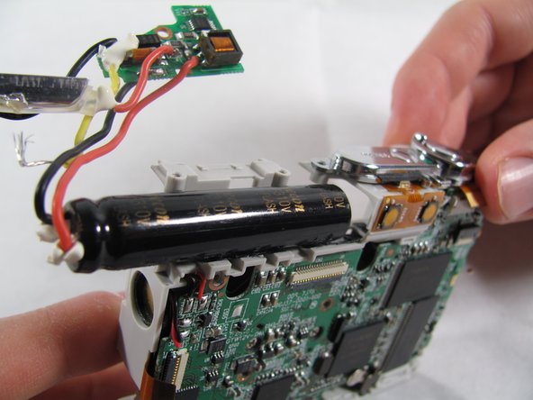 Removing Olympus FE-210 Flash Assembly: crwdns2935265:011crwdnd2935265:02crwdnd2935265:03crwdne2935265:0