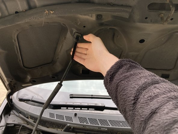 Propping the hood open is an important safety measure and will also allow light to enter the engine compartment and help you see better.