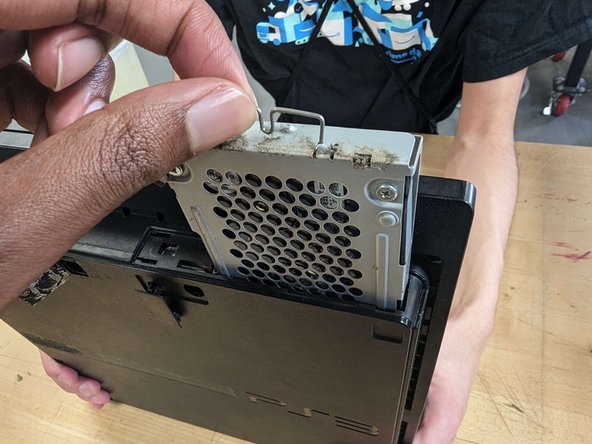 PlayStation 3 Slim Thermal Paste Replacement, Hard drive removal: crwdns2935265:04crwdnd2935265:02crwdnd2935265:03crwdne2935265:0