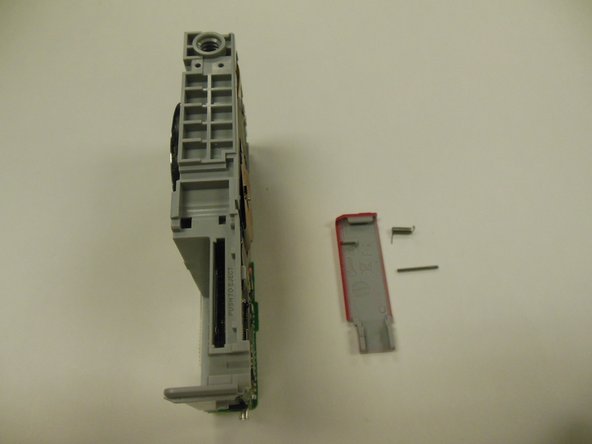 Kodak EasyShare M381 Battery Latch Replacement: crwdns2935265:016crwdnd2935265:02crwdnd2935265:02crwdne2935265:0