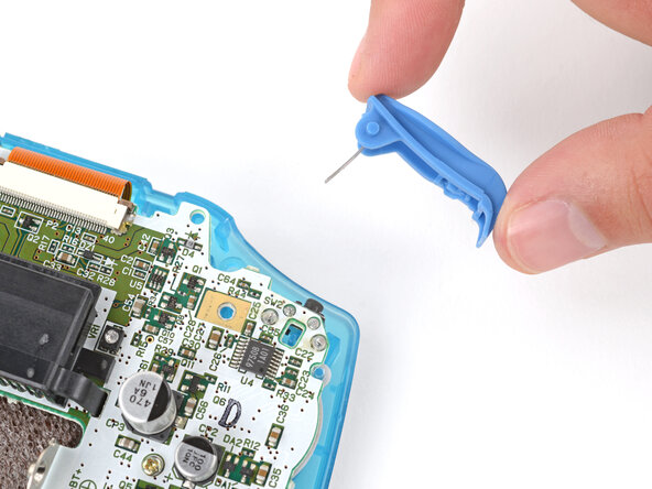 How to Reshell Your Game Boy Advance, Install the shoulder buttons: crwdns2935265:031crwdnd2935265:01crwdnd2935265:03crwdne2935265:0