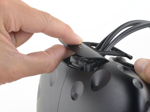HTC Vive Compartment Cover Assembly Replacement, Open the cable compartment: crwdns2935265:03crwdnd2935265:03crwdnd2935265:03crwdne2935265:0