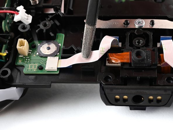 DualSense Edge Back Button Boards Replacement, Disconnect the back button ribbon cable: crwdns2935265:023crwdnd2935265:02crwdnd2935265:02crwdne2935265:0