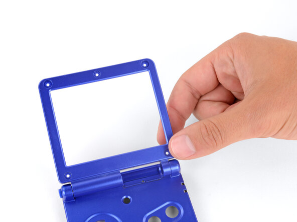 How to Reshell Your Game Boy Advance SP, Remove the screen bezel: crwdns2935265:030crwdnd2935265:01crwdnd2935265:03crwdne2935265:0