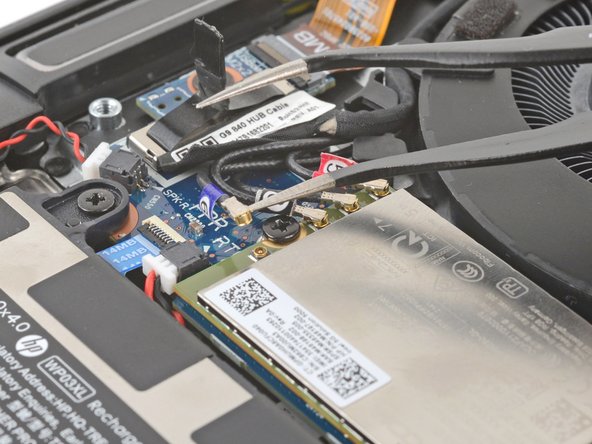 HP EliteBook 845 G9 WWAN Module Replacement, Disconnect the WWAN module: crwdns2935265:08crwdnd2935265:02crwdnd2935265:03crwdne2935265:0